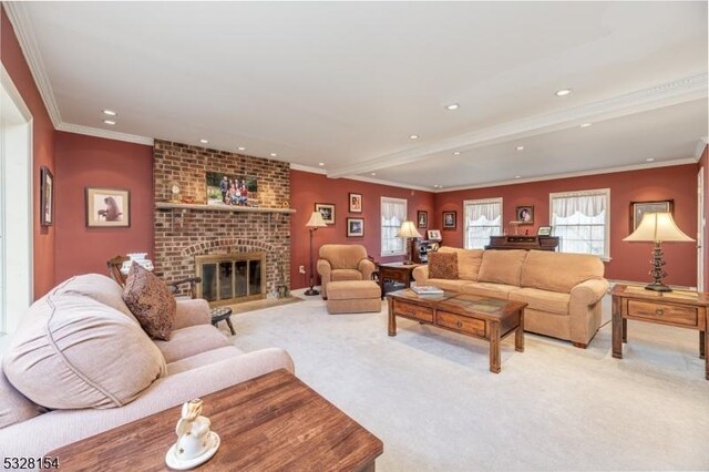 living room featuring recessed lighting, light colored carpet, a fireplace, and crown molding