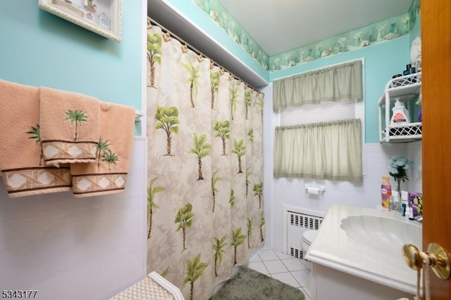 full bath featuring tile patterned floors, radiator, vanity, and a shower with curtain