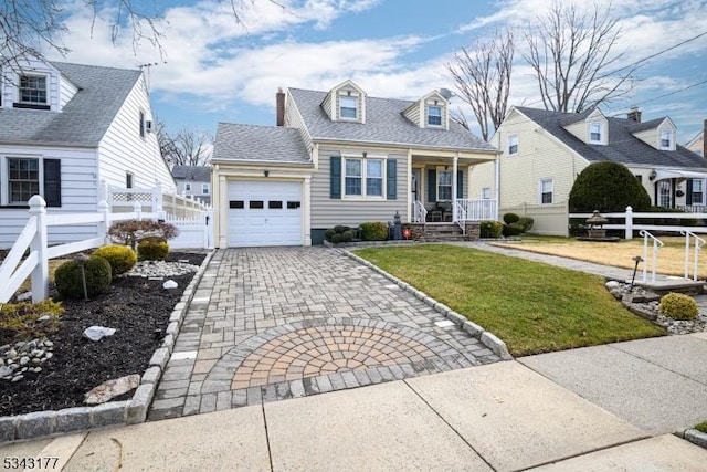 cape cod home featuring a front lawn, fence, a porch, decorative driveway, and an attached garage