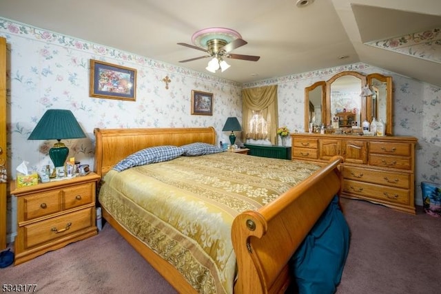 bedroom with carpet floors, lofted ceiling, a ceiling fan, and wallpapered walls