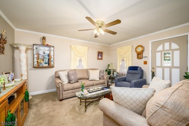 living room featuring ceiling fan, crown molding, baseboards, and light carpet