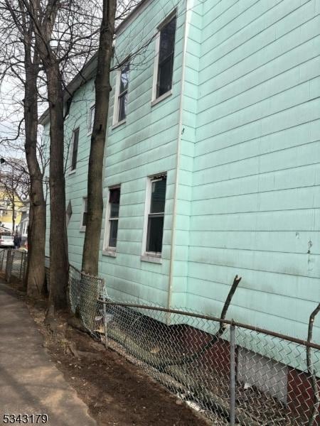 view of side of property with fence