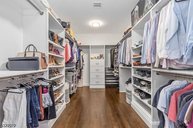 walk in closet featuring visible vents and wood finished floors