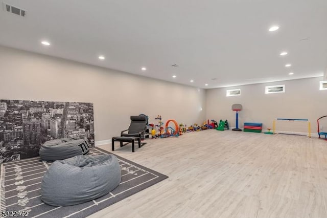 playroom featuring visible vents, recessed lighting, baseboards, and wood finished floors