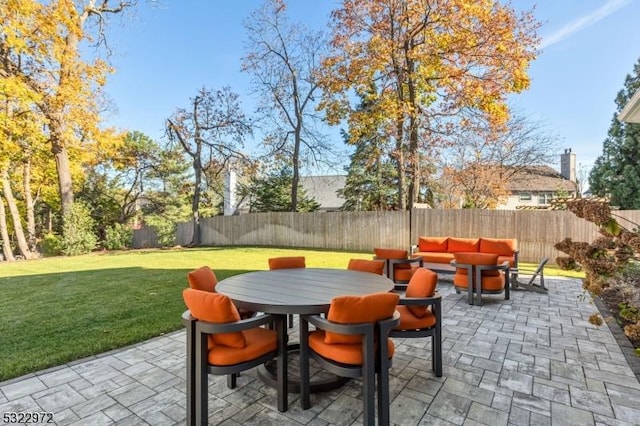 view of patio with a fenced backyard and outdoor dining space