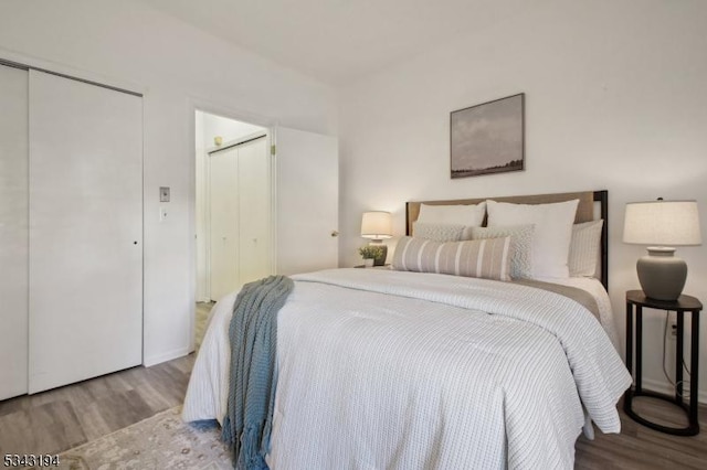 bedroom with wood finished floors