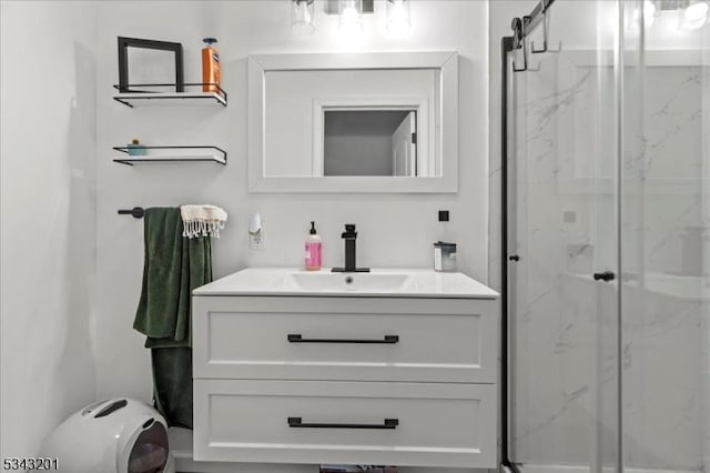 bathroom featuring a marble finish shower, toilet, and vanity