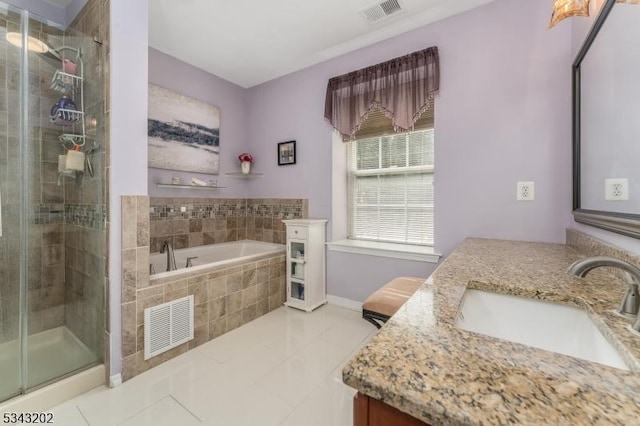 full bath featuring visible vents, a stall shower, vanity, and a garden tub