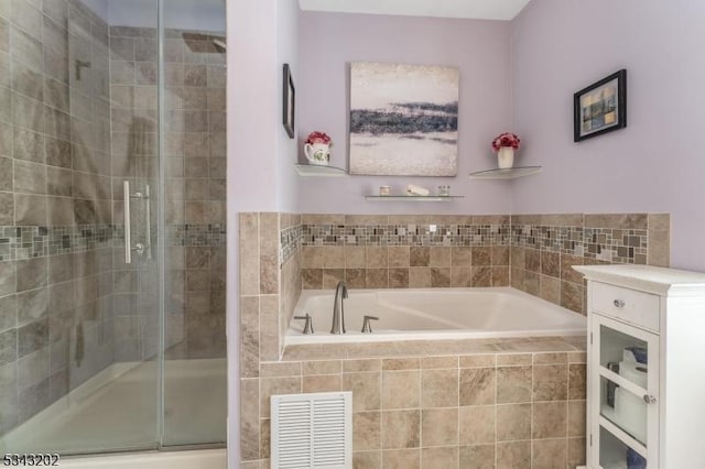 full bathroom with visible vents, a stall shower, and a bath