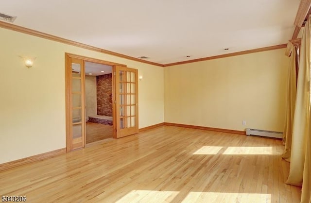 empty room featuring french doors, light wood-style floors, crown molding, baseboards, and baseboard heating