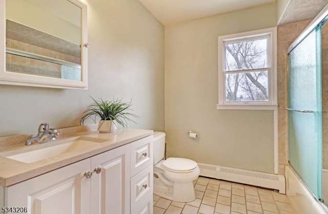 bathroom with shower / bath combination with glass door, toilet, vanity, and a baseboard radiator