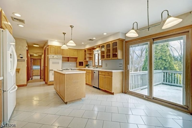 kitchen featuring visible vents, open shelves, a kitchen island, white appliances, and light countertops