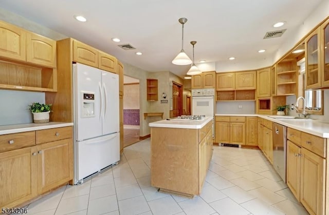 kitchen featuring visible vents, white appliances, a kitchen island, and open shelves