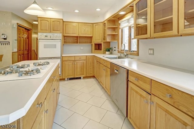 kitchen featuring light brown cabinets, a sink, open shelves, white appliances, and light countertops