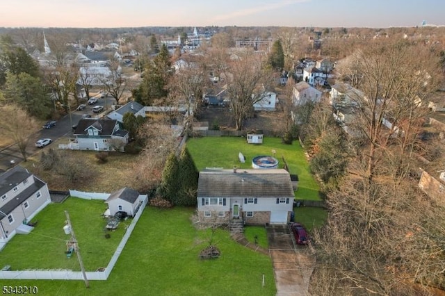 birds eye view of property with a residential view