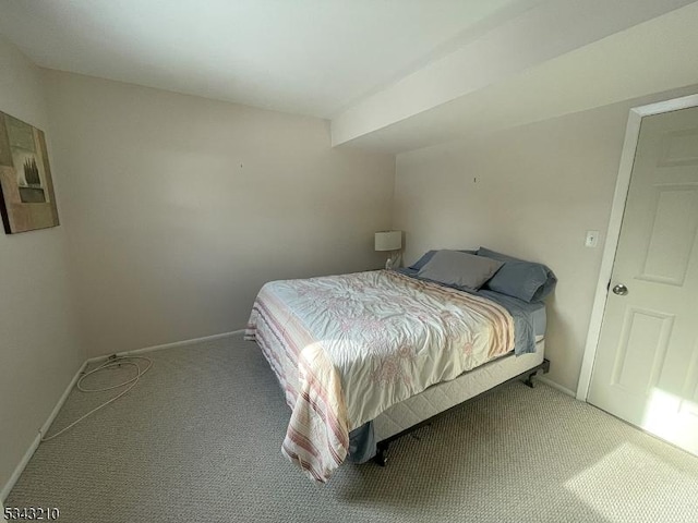 carpeted bedroom with baseboards