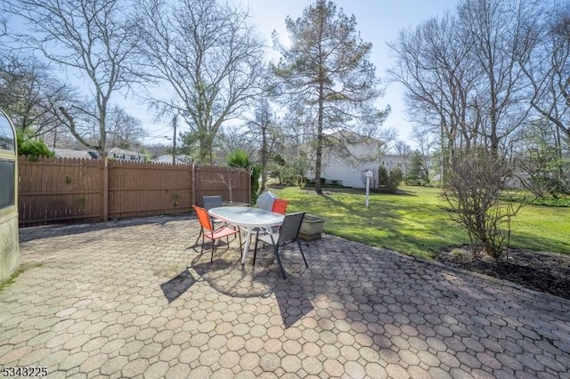 view of patio / terrace with outdoor dining area and fence