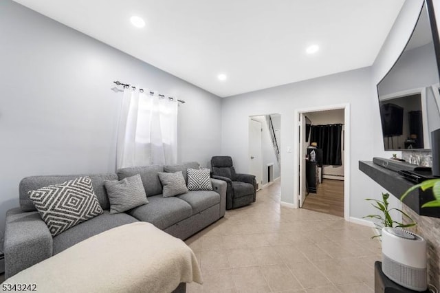 living area with recessed lighting, baseboards, and light tile patterned floors