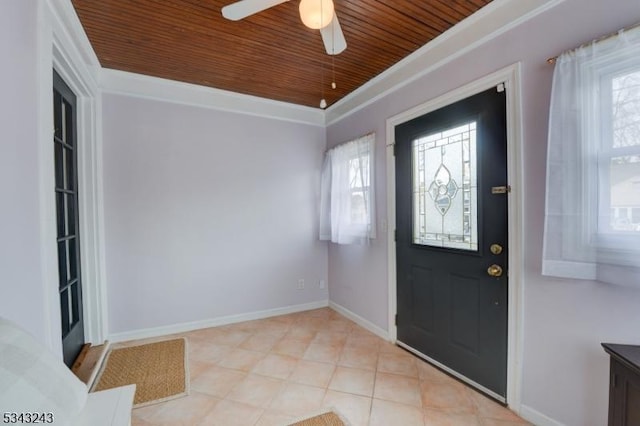 entryway with wooden ceiling, crown molding, a ceiling fan, and baseboards