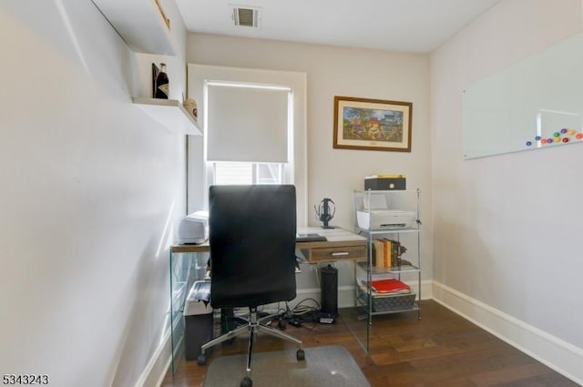 home office with visible vents, baseboards, and wood finished floors