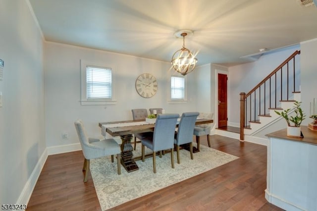 dining room with visible vents, baseboards, dark wood finished floors, stairway, and a notable chandelier