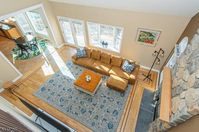 living room featuring baseboards and wood finished floors