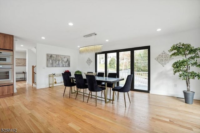 dining room with light wood-style flooring, recessed lighting, and baseboards