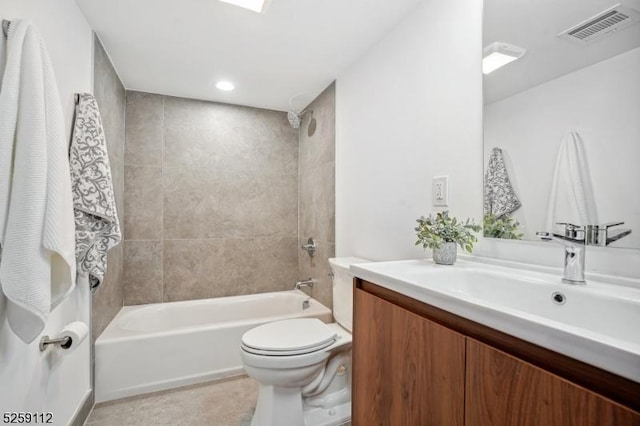 full bath featuring visible vents, toilet, a skylight, tub / shower combination, and vanity