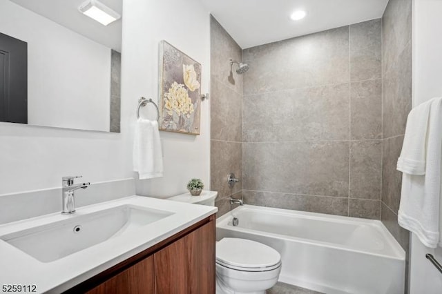 bathroom featuring vanity, toilet, and shower / bathtub combination