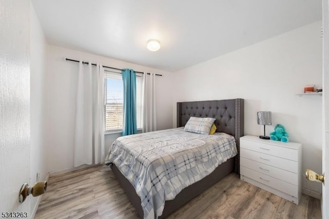 bedroom with light wood-type flooring