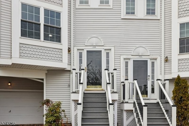 entrance to property featuring an attached garage