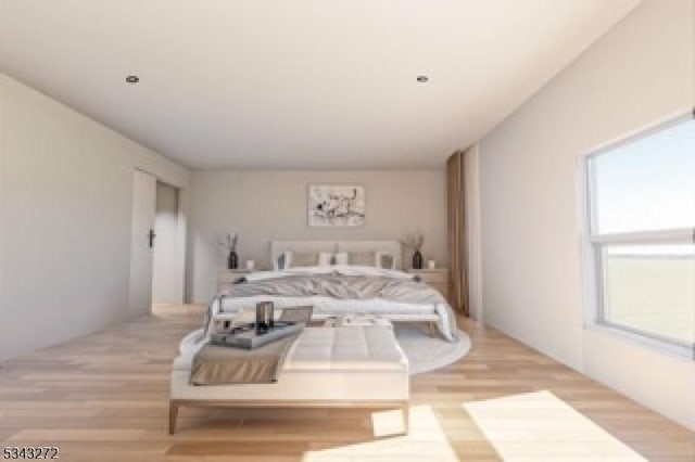 bedroom with light wood finished floors