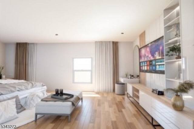 bedroom with light wood-style floors