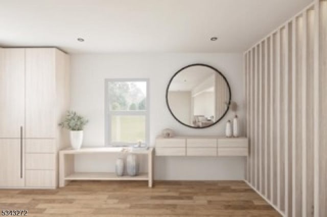 bathroom with vanity and wood finished floors