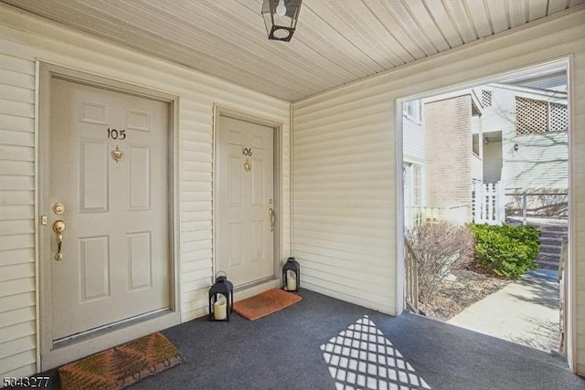 property entrance with covered porch