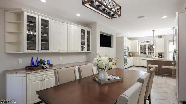 dining area featuring recessed lighting