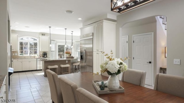 dining room featuring recessed lighting and light tile patterned flooring