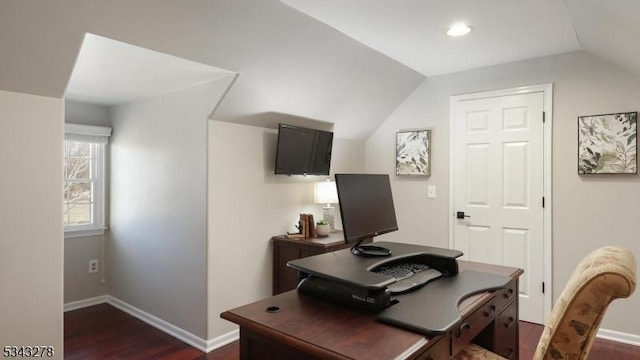 office area featuring dark wood finished floors, lofted ceiling, and baseboards