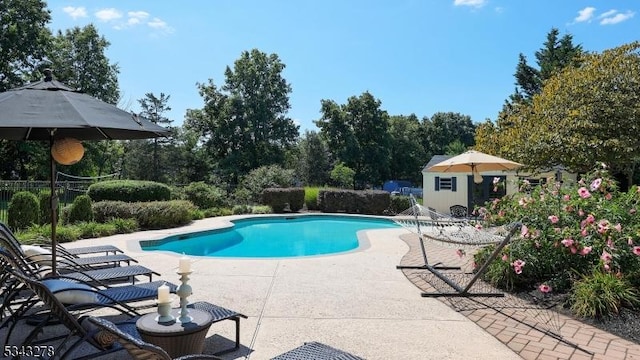 outdoor pool featuring a patio