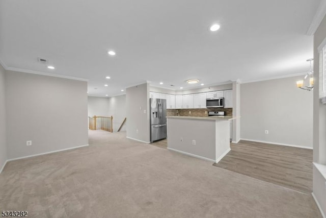 unfurnished living room featuring recessed lighting, baseboards, and ornamental molding