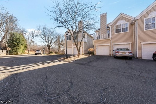 view of road with aphalt driveway