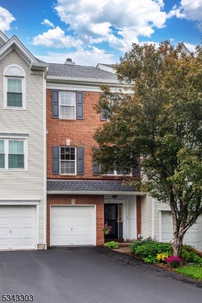 3 Knox Ct, Bernards Twp, NJ 07920 - view of property featuring driveway, an attached garage, and brick siding