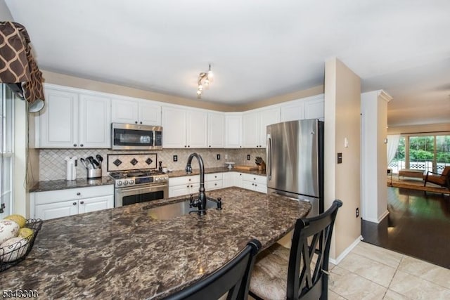 3 Knox Ct, Bernards Twp, NJ 07920 - kitchen with appliances with stainless steel finishes, white cabinets, backsplash, and dark stone countertops