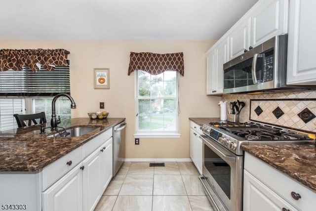 3 Knox Ct, Bernards Twp, NJ 07920 - kitchen with stainless steel appliances, tasteful backsplash, white cabinetry, and dark stone counters