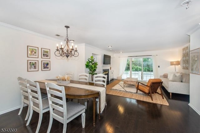 3 Knox Ct, Bernards Twp, NJ 07920 - dining space with a chandelier, dark wood-style floors, ornamental molding, and a fireplace