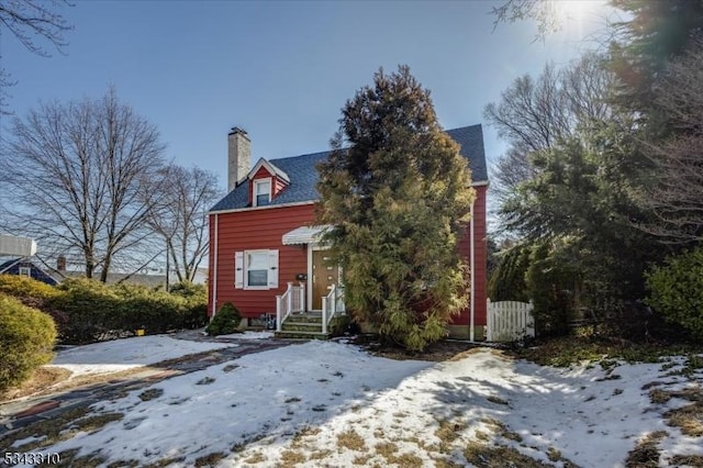 view of front of home featuring a chimney