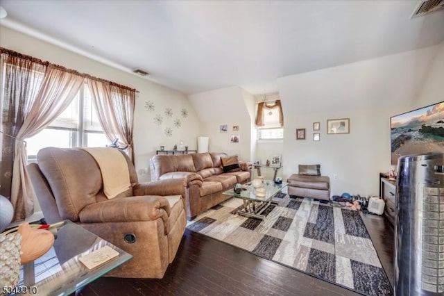 living room featuring hardwood / wood-style flooring and visible vents