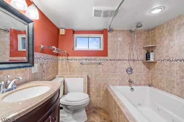 full bathroom featuring tile walls, toilet, and a combined bath / shower with jetted tub