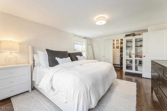 bedroom with wood finished floors