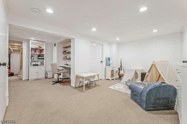 sitting room featuring recessed lighting and light carpet